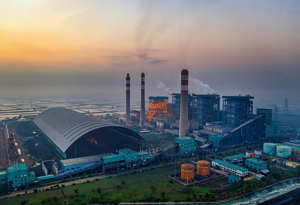 Aerial view of a large industrial power plant in Banten, Indonesia at sunset.